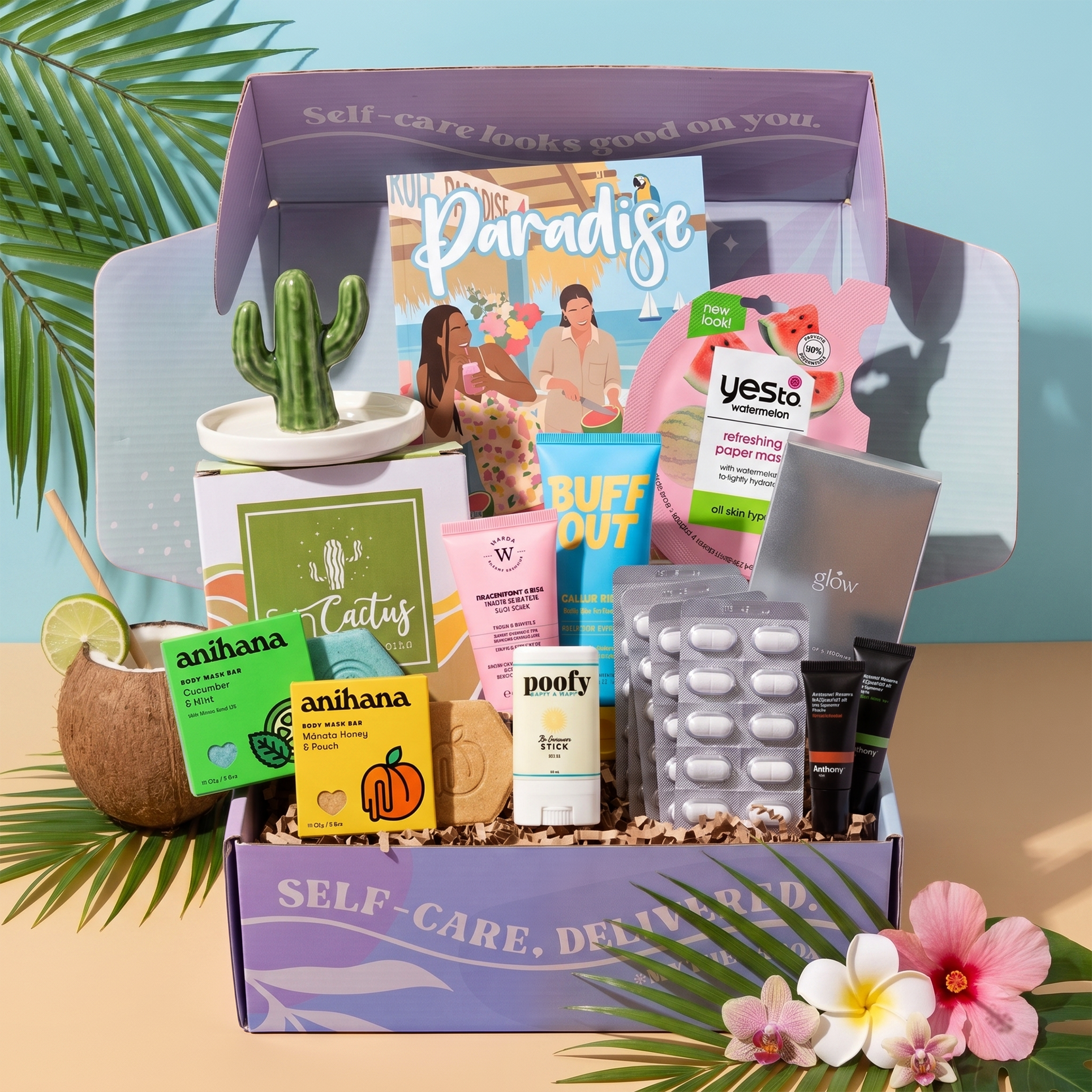The TheraBox Paradise box features WARDA SKINCARE Dragonfruit & BHA Tropical Detox Clay Mask, BUFFOUT Callus Eraser Scrub Gel, ANIHANA Body Wash Bar, POOFY ORGANICS The Sunscreen Stick SPF 30+, YES TO Watermelon Refreshing Paper Mask, ANTHONY Lip Balm SPF 25, GLOW IS HERE Vitamin C Chewable, HAPPY SHOPPE Cactus Trinket Dish, and FAMILIUS X KATHRYN THOMPSON’s Drops of Awesome.