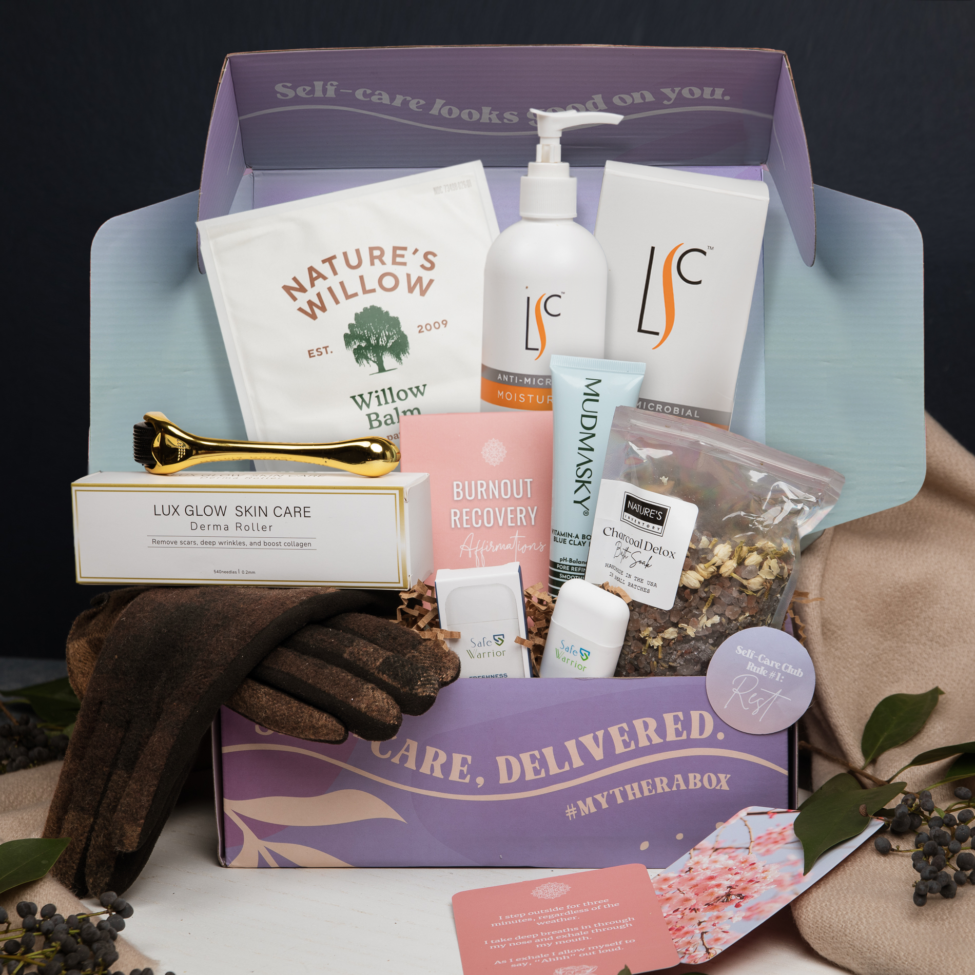 The TheraBox Haven box features LABORATORY SKIN CARE Antimicrobial Moisturizer, MUDMASKY Vitamin-A Booster Blue Clay Mask, TOP IT OFF ACCESSORIES Sherry Gloves, NATURE’S INVENTORY Charcoal Detox Bath Soak, LUX GLOW SKIN CARE Derma Roller, SAFE WARRIOR Refresh Inhaler Stick, NATURE’S WILLOW XL Pain Relieving Patch, and CARRIE SEVERSON Burnout Recovery Affirmation Cards.