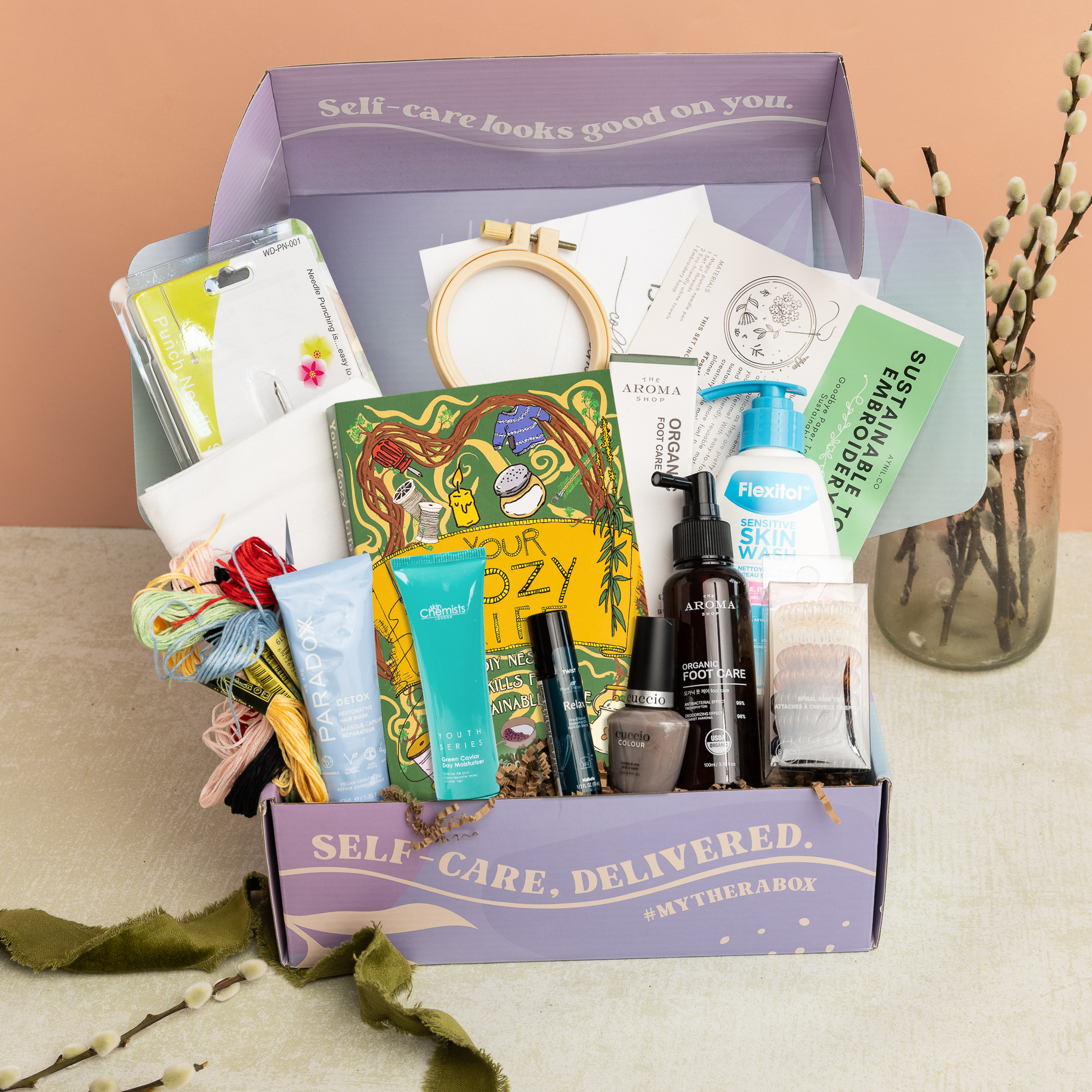 TheraBox Refresh Box featuring We Are Paradoxx | Detox Restorative Mask,  Skin Chemist | Youth Series Green Caviar Day Moisturizer,  Cucciosomatology | Cuccio Colour Nail Polish - True Nort,  Plant Therapy | Relax Roll On, The Aroma Shop | Organic Foot Care Mist, Flexitol | Sensitive Skin Wash, Common Care Hair | 8-Pack Spiral Hair Ties, Raleigh Briggs | Your Cozy Life, and Sustainable Towel Embroidery Kit