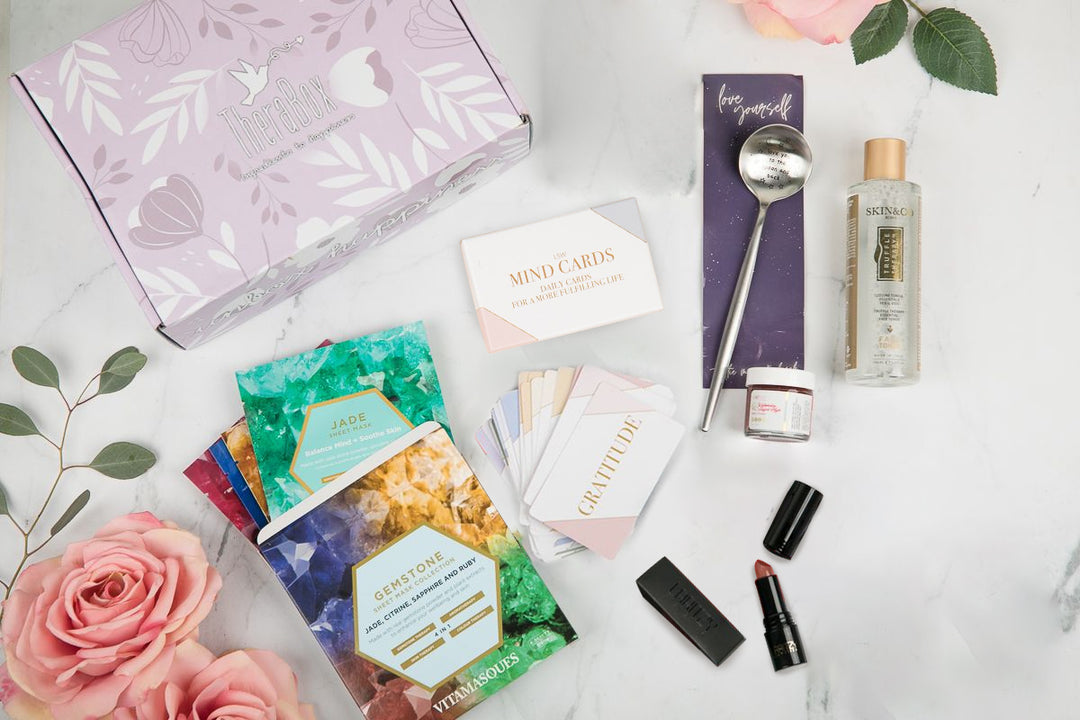 Therabox Amour box featuring 9 self care items ranging from bath and body to skincare items