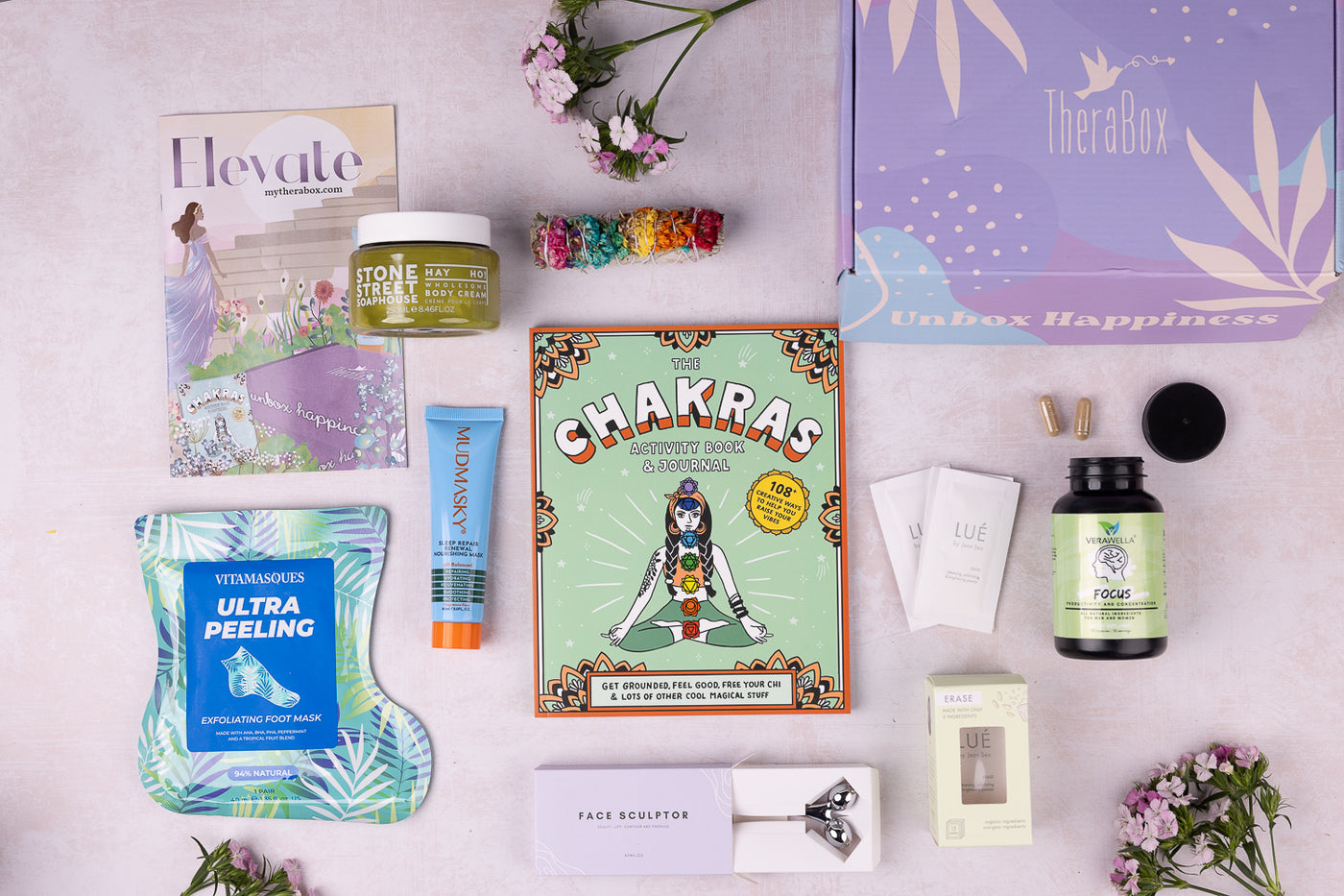 Therabox Elevate box featuring 8 self care items ranging from bath and body to skincare items