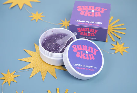 Sunny Skin | “Lunar” Plum Wish Eye Gel Mask  Sleepless nights and screen time can dim the twinkle in your eyes, but this “Lunar” Gel Mask wipes out those under-eye shadows! Pop the tub to reveal a galaxy of lunar shaped eye masks specifically designed to fit comfortably beneath the eye. Every patch is infused with brightening, soothing serum and packed with collagen.