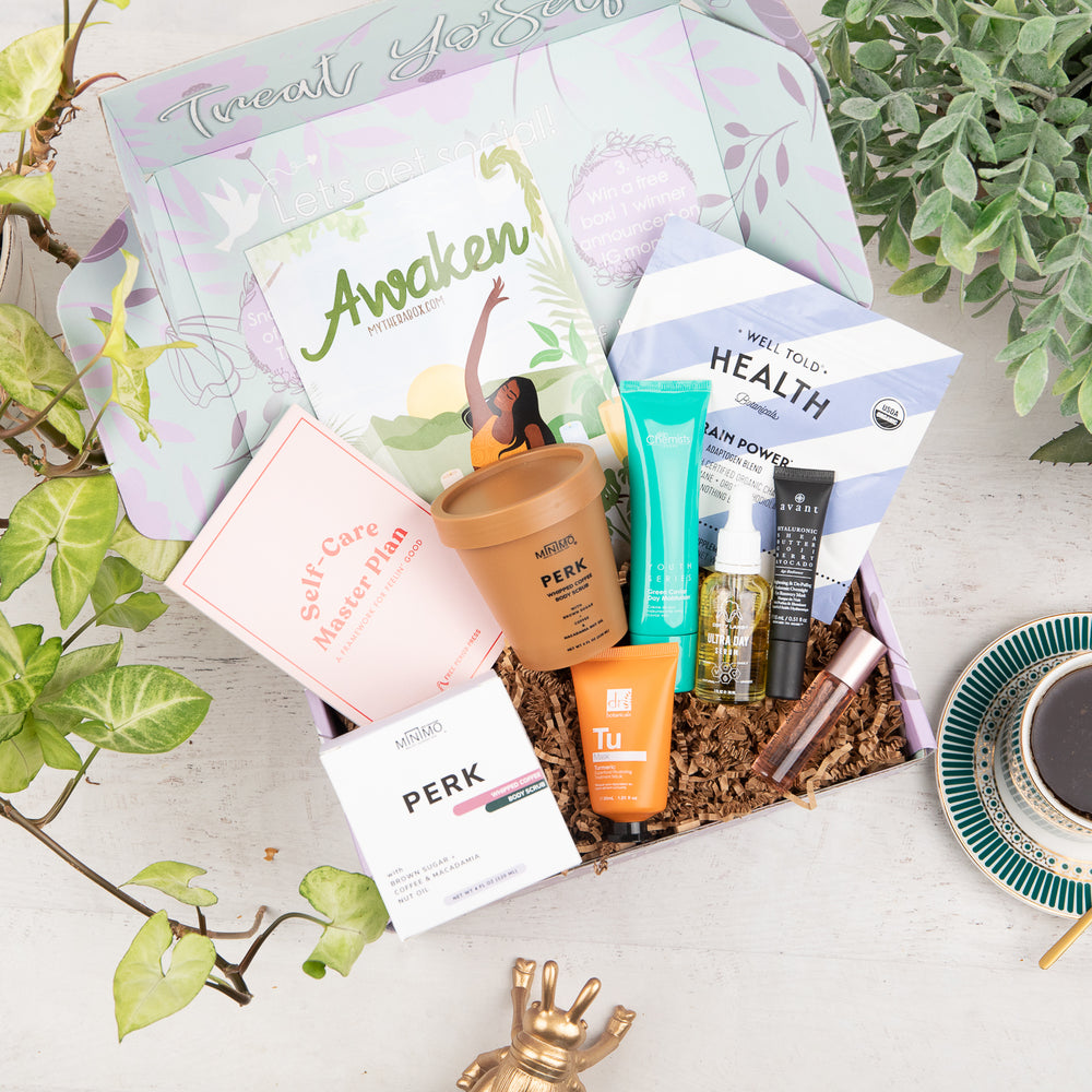 Therabox Awaken box featuring 9 self care items ranging from bath and body to skincare items