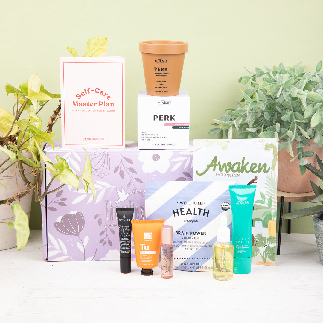 Therabox Awaken box featuring 9 self care items ranging from bath and body to skincare items